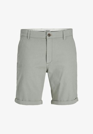 Svijetlozelene kratke hlače izrađene od teksturirane tkanine. Imaju preklopne rukave i jedan smeđi gumb u struku. Uključena su dva prednja džepa.