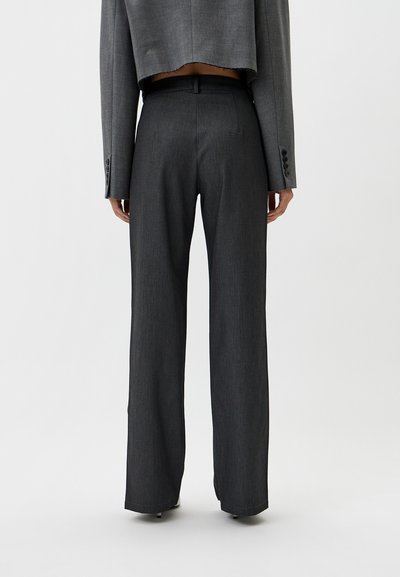 Gray tailored pants, high-waisted, with a straight leg cut. Features a smooth texture and subtle patterned fabric. Back view shows neat stitching.