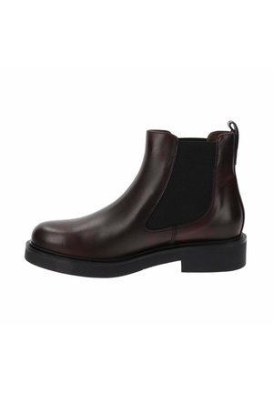 Bottes Chelsea en cuir brun avec des panneaux élastiques sur les côtés, bout rond et semelle en caoutchouc noir épaisse. Comprend un tirant pour un enfilage facile.