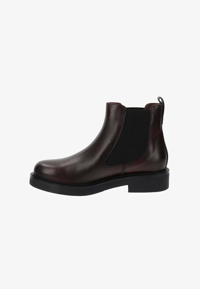 Bruine leren Chelsea-boot met elastische zijpanelen, ronde neus en een dikke zwarte rubberen zool. Heeft een lusje voor eenvoudig aan- en uittrekken.
