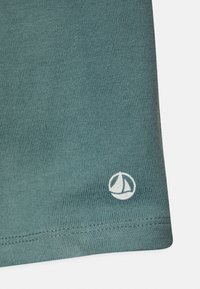 Petit Bateau Träningsbyxor - brut