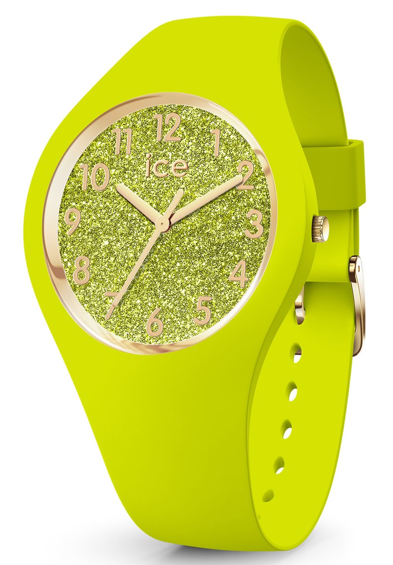 Reloj de silicona amarillo neón con una esfera verde brillante, marcadores de hora dorados y acentos dorados. Presenta una caja redonda y una correa ajustable.
