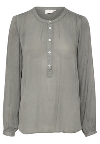 Blouse à manches longues gris clair avec un col rond, fermeture à boutons sur le devant et tissu texturé. Dispose de manches froncées et d'une coupe décontractée.