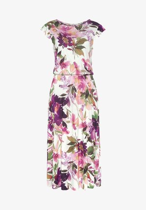 Gėlių maksima su minkšta medžiaga, dekoruota purpurinėmis, rožinėmis ir žaliomis detalėmis. Trumpomis rankovėmis, apvaliu iškirpimu ir elastinga juosmeniu, kuris suteikia formą.