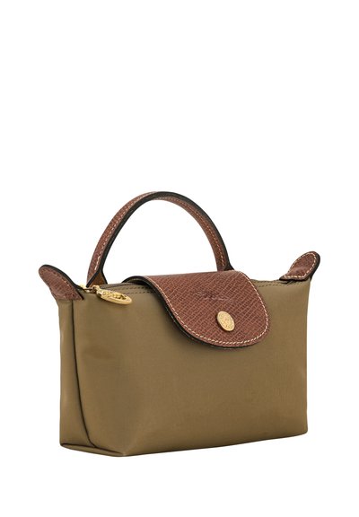 Small olive green handbag with textured brown leather handle and flap, gold zipper pull, and round gold button closure.