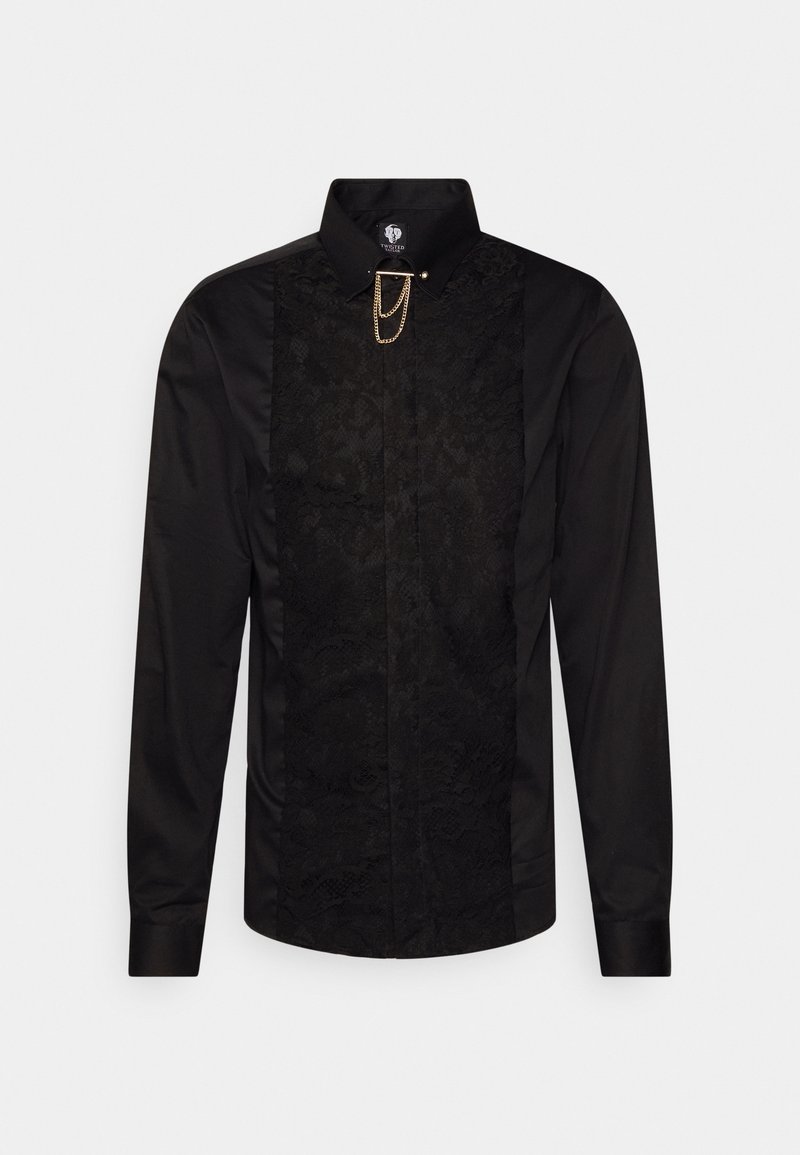 Chemise noire à manches longues avec un panneau avant en dentelle texturée, un col montant et un détail en chaîne dorée fixé au col.