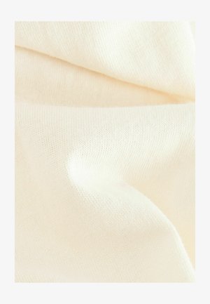 Tkanina boje kreme s glatkom, finom pletenom teksturom, koja prikazuje suptilne varijacije u debljini i nježnim padajem. Bez uzoraka ili akcenta.