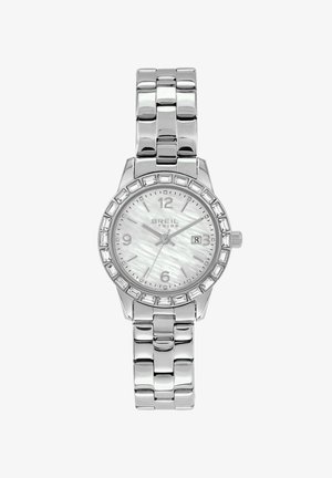 Sølvfarvet metalur med rund urskive, hvid perlemorsskive, krystalaccente på rammen og en poleret ledet armbånd.