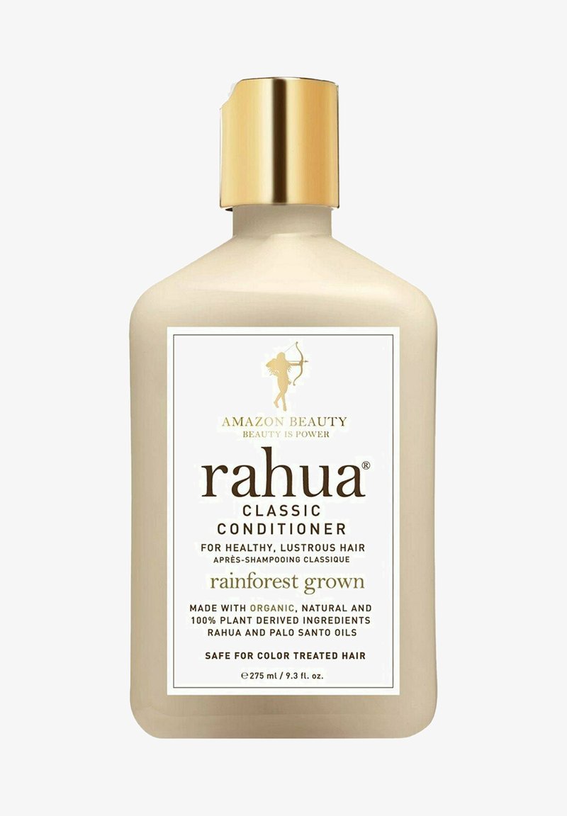 Après-shampooing Rahua Classic dans une bouteille en plastique beige avec un capuchon doré. L'étiquette affiche un texte noir et une silhouette, mettant en avant les ingrédients cultivés en pleine forêt.