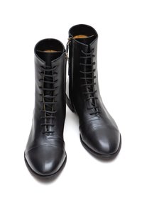 Black leather ankle boots with a smooth texture, featuring a lace-up design, round toe, and side zipper for easy wear.