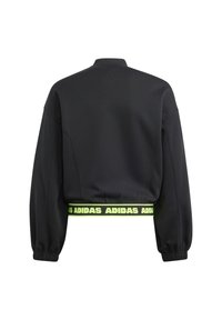 Felpa nera corta con colletto alto, polsini elastici e una fascia brandizzata "ADIDAS" di colore giallo neon in vita. Tessuto dalla consistenza liscia.