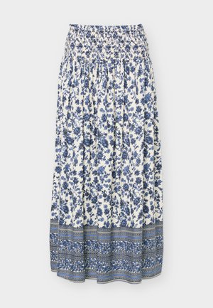 Jupe midi blanche à imprimé floral bleu, taille smockée, et bordure à motifs près de l'ourlet.