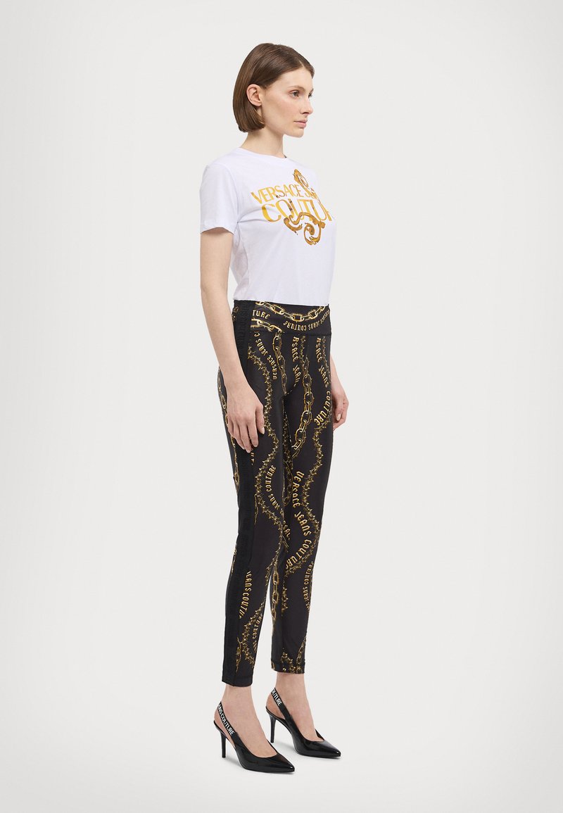 Versace Jeans Couture - CHAIN COUTURE - Leggings - black/gold, Ampliar