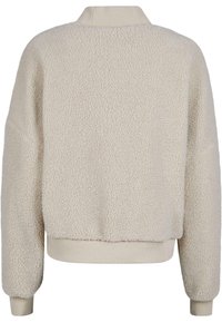 Hellbeige Fleece-Sweatshirt mit strukturiertem Oberfläche, geripptem Kragen und Bündchen sowie einem lässigen Schnitt. Einfaches, minimalistisches Design.