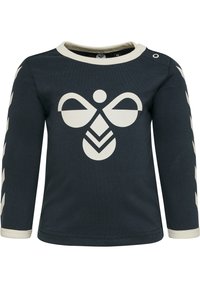 Mörkblå långärmad skjorta med crème-färgade detaljer, med en stor grafisk logotyp i mitten och ett chevron-mönster längs ärmarna. Tillverkad av mjukt bomullsmaterial.