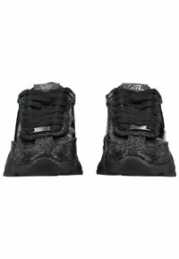 Pair of black low-top sneakers with textured fabric and leather details, thick soles, and black laces, shown from the front.