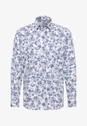 Camicia bianca a maniche lunghe con un motivo floreale blu e viola, chiusura con bottoni frontale e colletto classico.