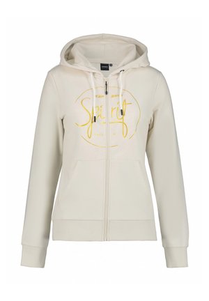 Sweatshirt à capuche zippé beige fabriqué en tissu lisse, avec un imprimé graphique jaune et deux poches avant, doté de cordons de serrage réglables.