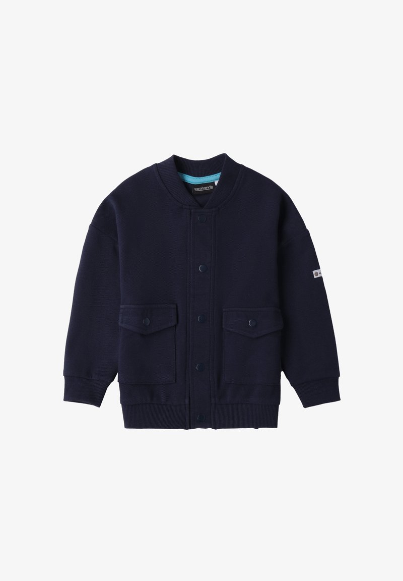 Granatowa bluza dresowa wykonana z teksturowanej tkaniny, z okrągłym kołnierzem, zatrzaskami i dwiema przednimi kieszeniami. Miękki, casualowy design.