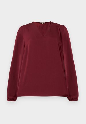 Burgundy pikkade varrukatega pluus V-kaelusega, millel on kokkutõmbunud mansetid, sile tekstuur ja lõdvestatud istuvus. Lihtne, minimalistlik disain.