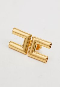Pair of polished gold-tone geometric square-shaped stud earrings with an open center, shown on a white background.