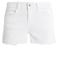 Bílé denimové šortky s přiléhavým střihem, zdobené krajkovou výšivkou na lemech. Obsahují přední kapsy a zapínání na knoflík.