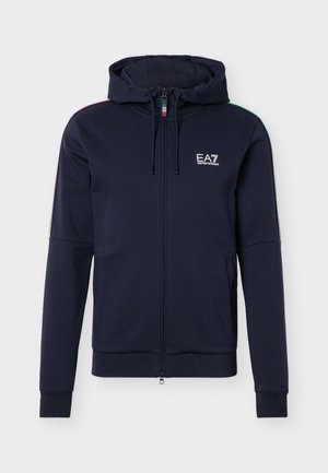Νavy μπλε ζακέτα με φερμουάρ και λογότυπο EA7 Emporio Armani στο στήθος και τρίχρωμες ρίγες στο φερμουάρ και τους ώμους.