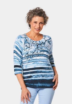 Blauw-wit gestreepte lange mouw top met bloemenpatroon. Katoenmix stof, relaxte pasvorm, ronde halslijn en driekwart mouwen.