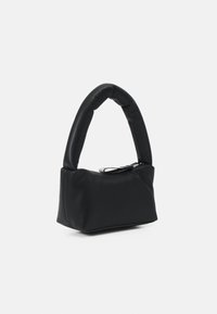 Black handbag made of smooth material, featuring a rounded handle and a zip closure. The design is compact with a soft, structured shape.