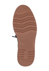 Suela de goma marrón con surcos texturizados para un mejor agarre, con elementos de diseño moldeados y una etiqueta con la talla 41.