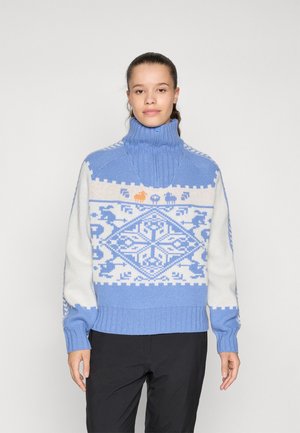 Blauwe en witte gebreide trui met een hoge kraag. Heeft een geometrisch ontwerp en dierenmotieven. Ribgebreide boorden en zoom. Zachte textuur.
