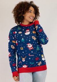 Blue Christmas sweater featuring Santa, reindeer, gifts, and trees. Red ribbed collar and cuffs. Made from soft fabric with a festive pattern.