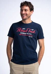 Navy blue cotton T-shirt with round neck, featuring white and red text: "Petrol Ind." and "Hawaii U.S.A." across the front.