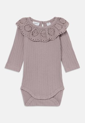 Long-sleeve ribbed bodysuit in muted lavender with a decorative eyelet ruffle collar and snap closure at the bottom. Soft cotton material.