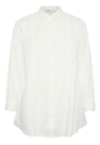 Camicia bianca con bottoni realizzata in tessuto testurizzato, caratterizzata da un colletto classico, maniche lunghe con polsini arricciati e dettagli laterali sottili.