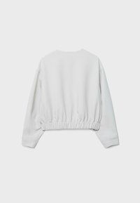 Sweatshirt blanc à manches longues, court, avec ourlet élastique et col rond, montré de dos sur un fond uni.