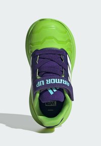 Green and purple athletic shoe with a glossy finish, featuring a hook-and-loop strap, textured rubber sole, and a Marvel logo inside.