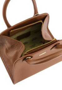 Brown pebbled leather handbag with dual handles, gold zipper, and green interior lining featuring a repeating brand logo pattern.