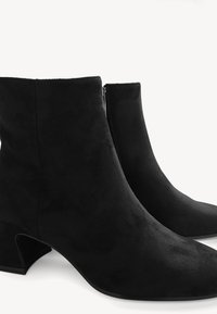 Black suede ankle boots with a pointed toe, mid-height block heel, and a side zipper. Smooth texture with a matte finish.