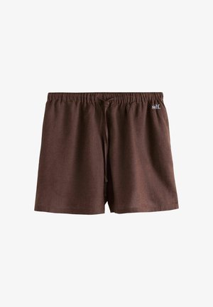 Shorts marron décontractés avec taille élastique, cordon de serrage à l'avant et petit logo blanc "self." en haut à gauche.