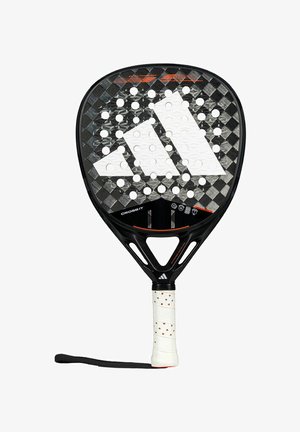 Black paddle with a textured carbon fiber surface, white logo detail, and perforated holes. Grip is white with black accents and a wrist strap.