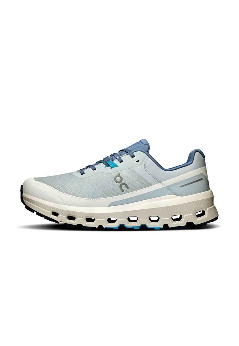 Light blue running shoe with a breathable mesh upper, cushioned sole, and notable cut-out pattern along the midsole. Grey accents and laces.