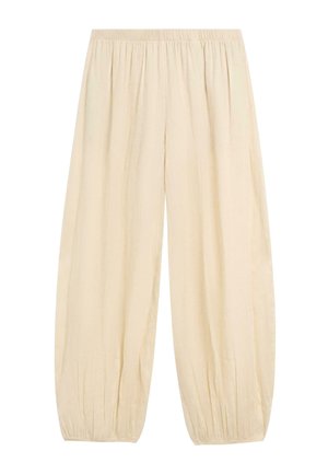 Cremefarbene, locker sitzende Hose mit elastischem Bund und gerafften elastischen Bündchen, aus leichtem Stoff gefertigt.