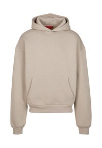 Haut à capuche beige surdimensionné en mélange de coton doux, avec une poche kangourou, des poignets côtelés et une capuche avec cordon de serrage. Texture lisse.