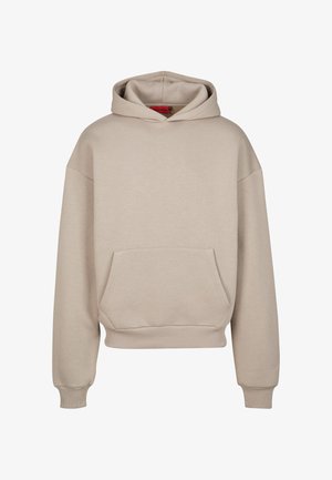 Bézs színű, túlméretezett kapucnis pulóver, puha pamut keverékből készült, kenguru zsebes, bordás mandzsettákkal és állítható kapucnival. Sima textúra.