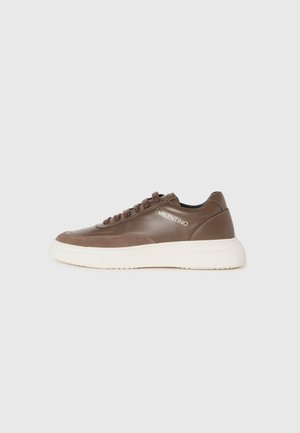 Brown leather sneaker with a textured suede overlay and white rubber sole. Features round laces and "VALENTINO" logo on the side.
