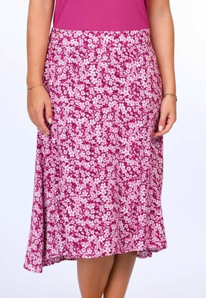 Blumiger Midirock mit einem lebhaften pinken Hintergrund und weißen Blumen, aus leichtem Stoff, mit einem ausgestellten Saum und einem elastischen Bund.