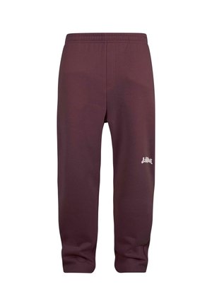 Maronfarvede sweatpants med elastisk talje, tapered ben og et lille hvidt logo på venstre lår. Glat tekstur, afslappet design.