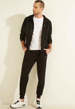 Guess Pantalon de survêtement - schwarz