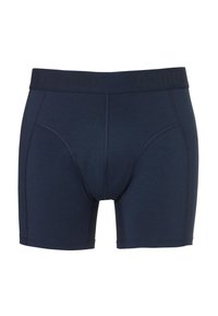 Navy blue boxer shorts made from soft material, featuring an elastic waistband with "nomad" logo and a close-fit design with short legs.